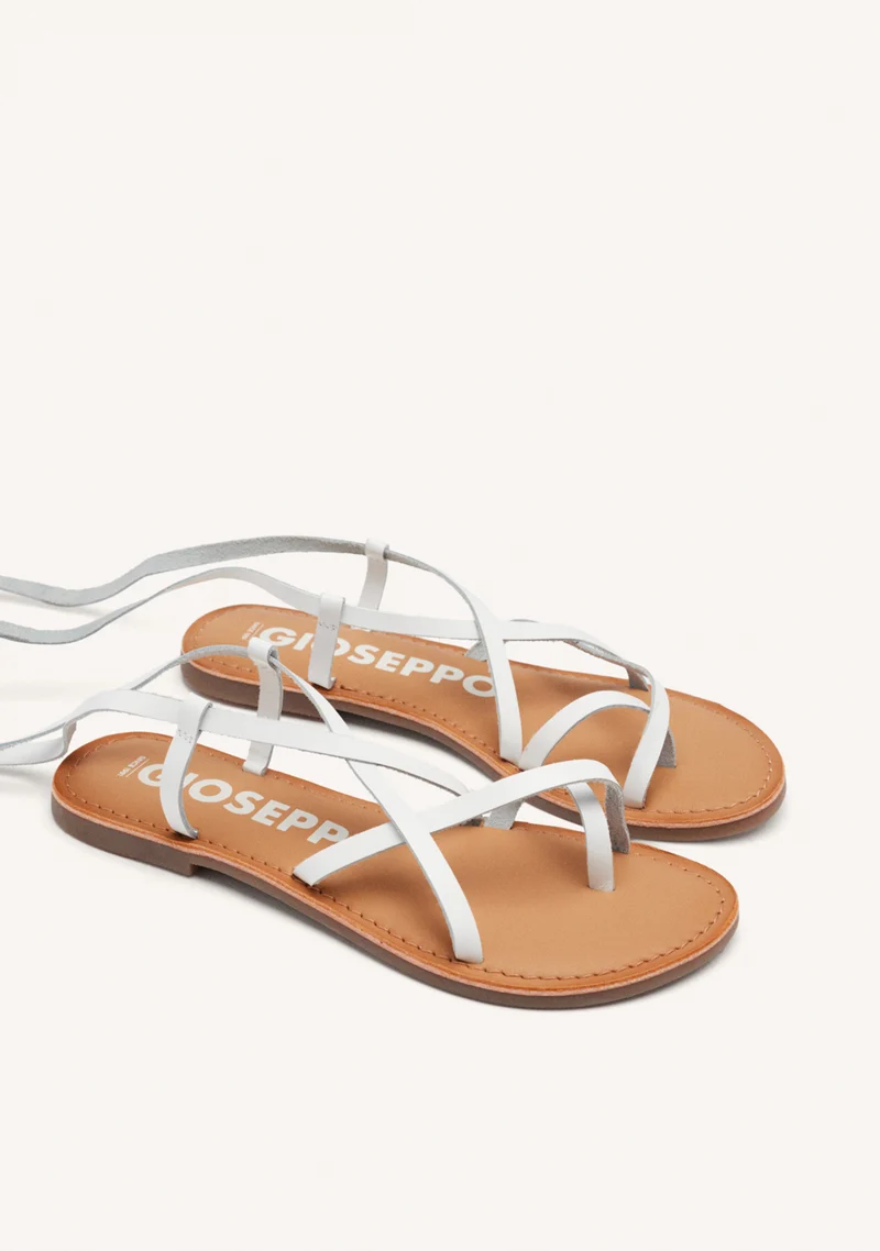 Lussat sandals with thin tan straps to tie around the leg