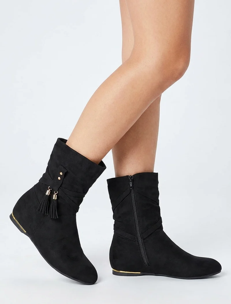 Bottines montantes en suédine à pompons - Noir