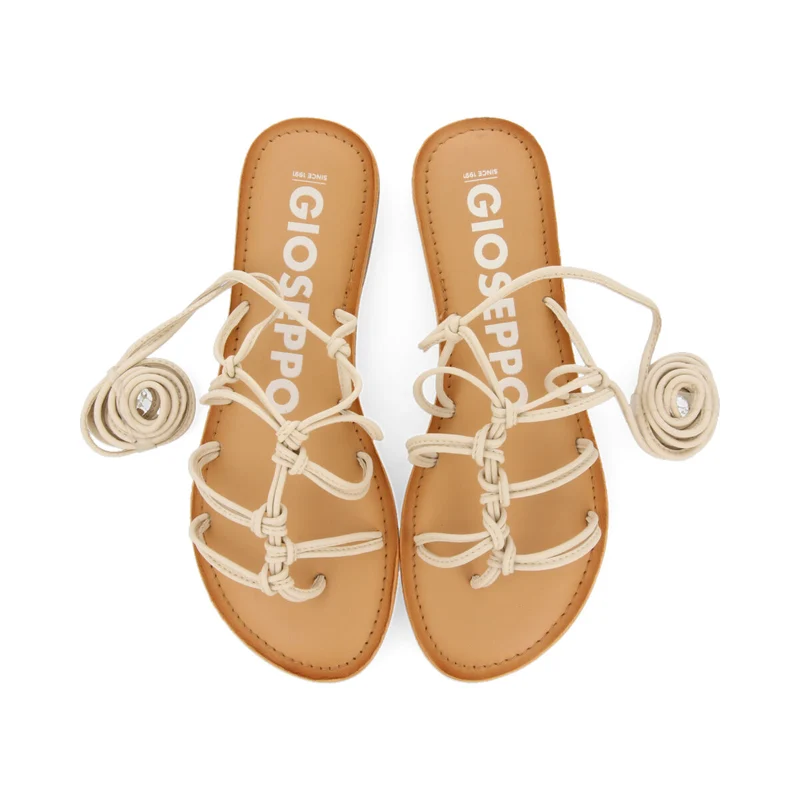 Mambai women's flat off-white leather sandals with thin straps and decorative knots