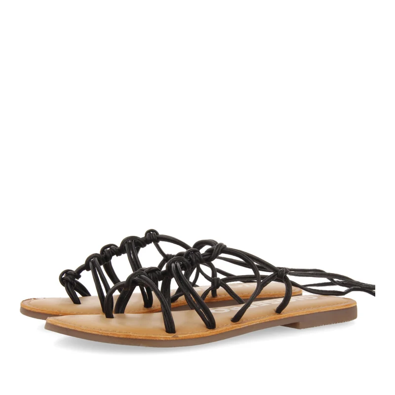 Mambai women's flat black leather sandals with thin straps and decorative knots