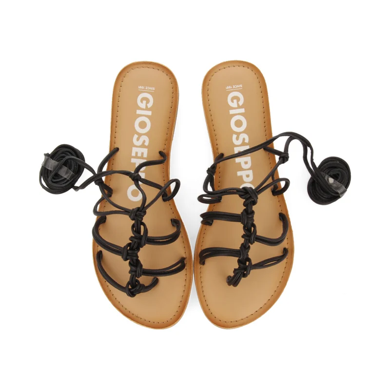 Mambai women's flat black leather sandals with thin straps and decorative knots