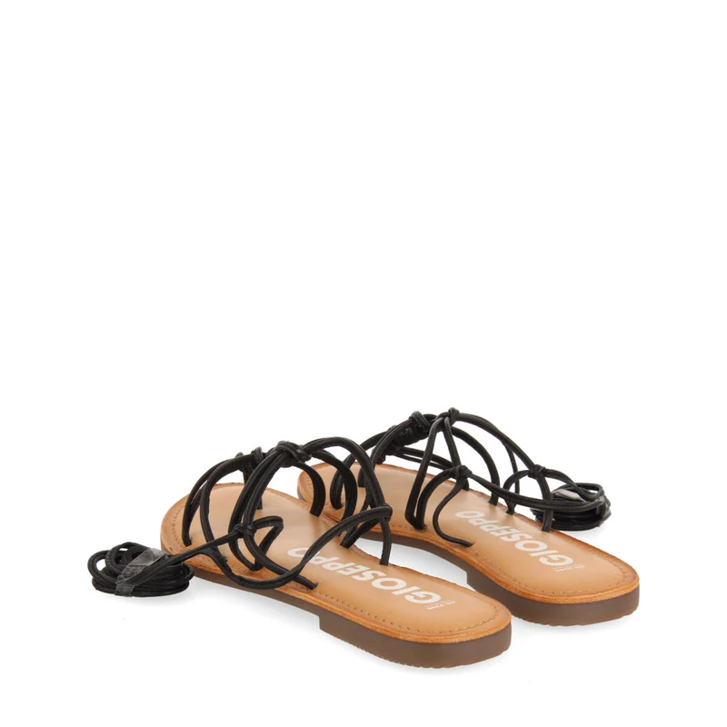 Mambai women's flat black leather sandals with thin straps and decorative knots