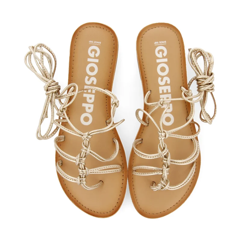 Kern women's flat gold leather sandals with thin straps and decorative knots