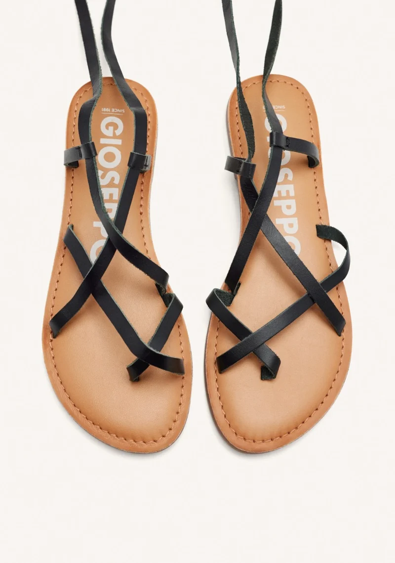 Lussat sandals with thin black straps to tie around the leg