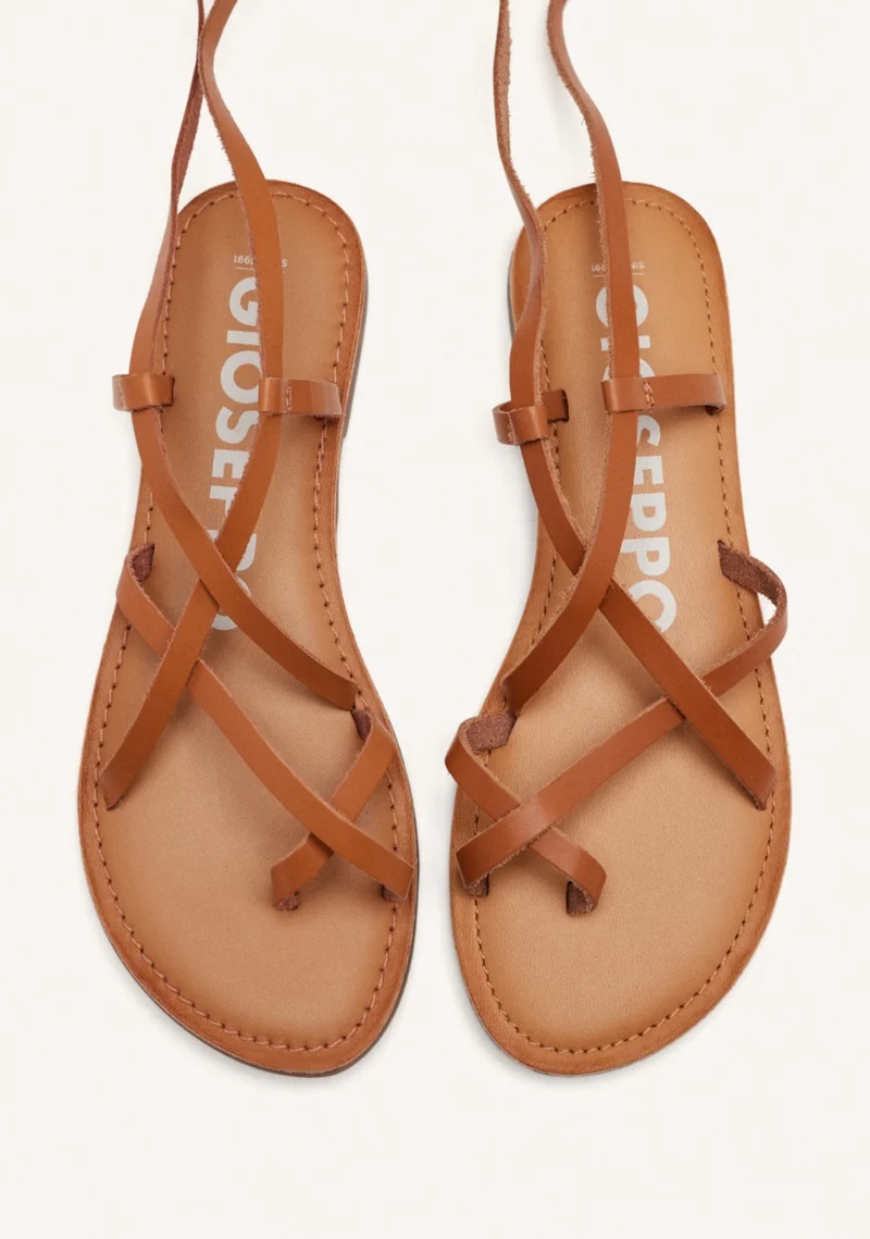 Lussat sandals with thin tan straps to tie around the leg