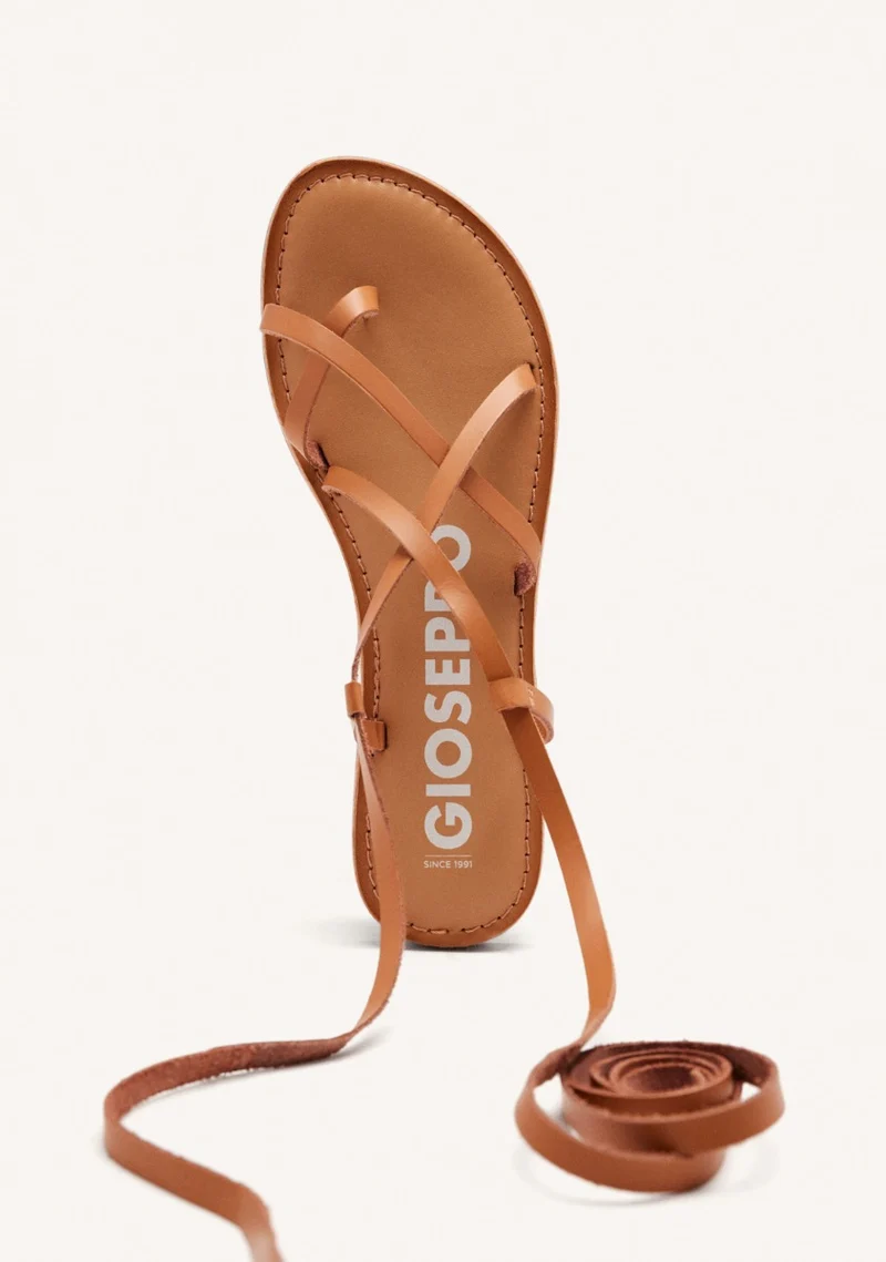 Lussat sandals with thin tan straps to tie around the leg