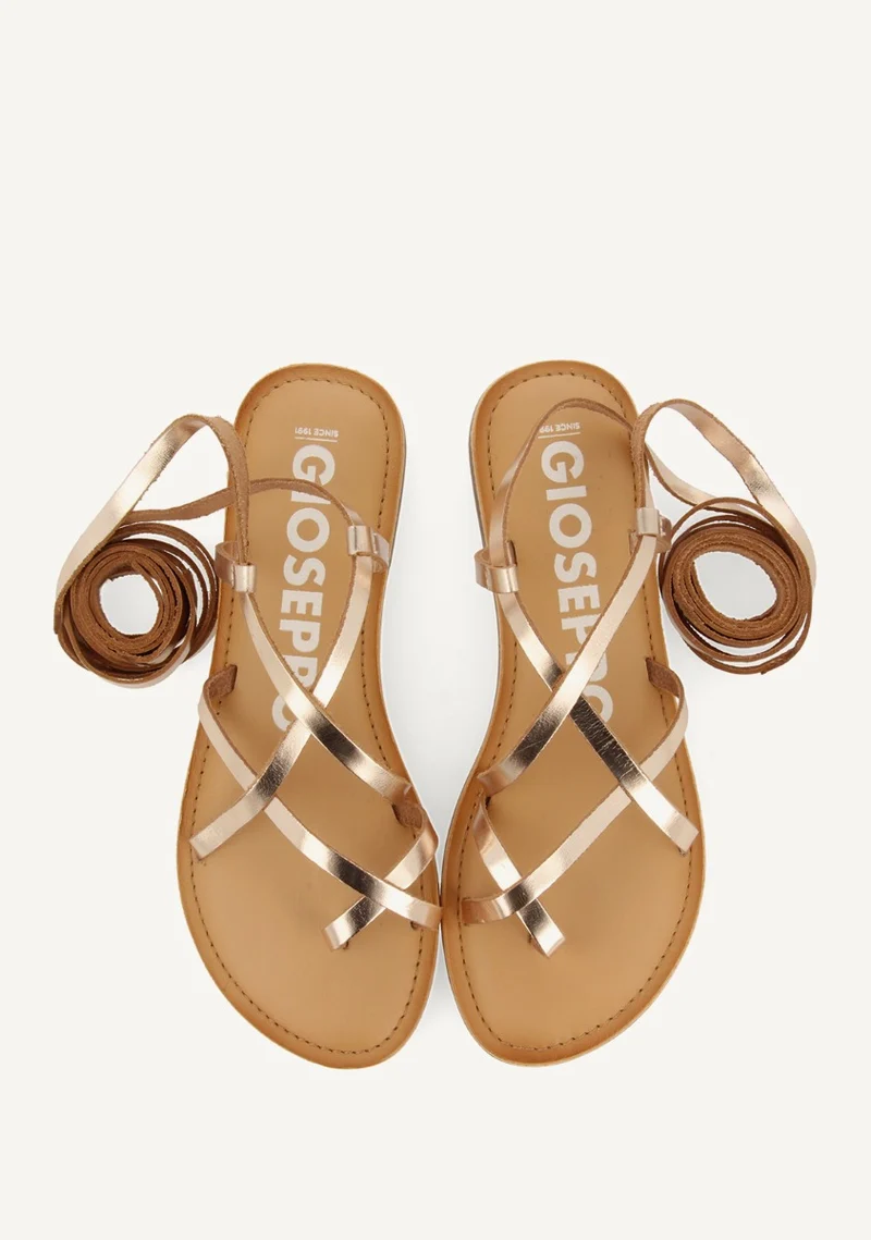 Lussat sandals with thin gold straps to tie around the leg